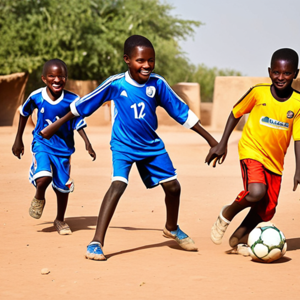 니제르에서 인기 있는 스포츠 - Football Passion**
"A vibrant scene of children playing football (soccer) in a Niger village, fully...